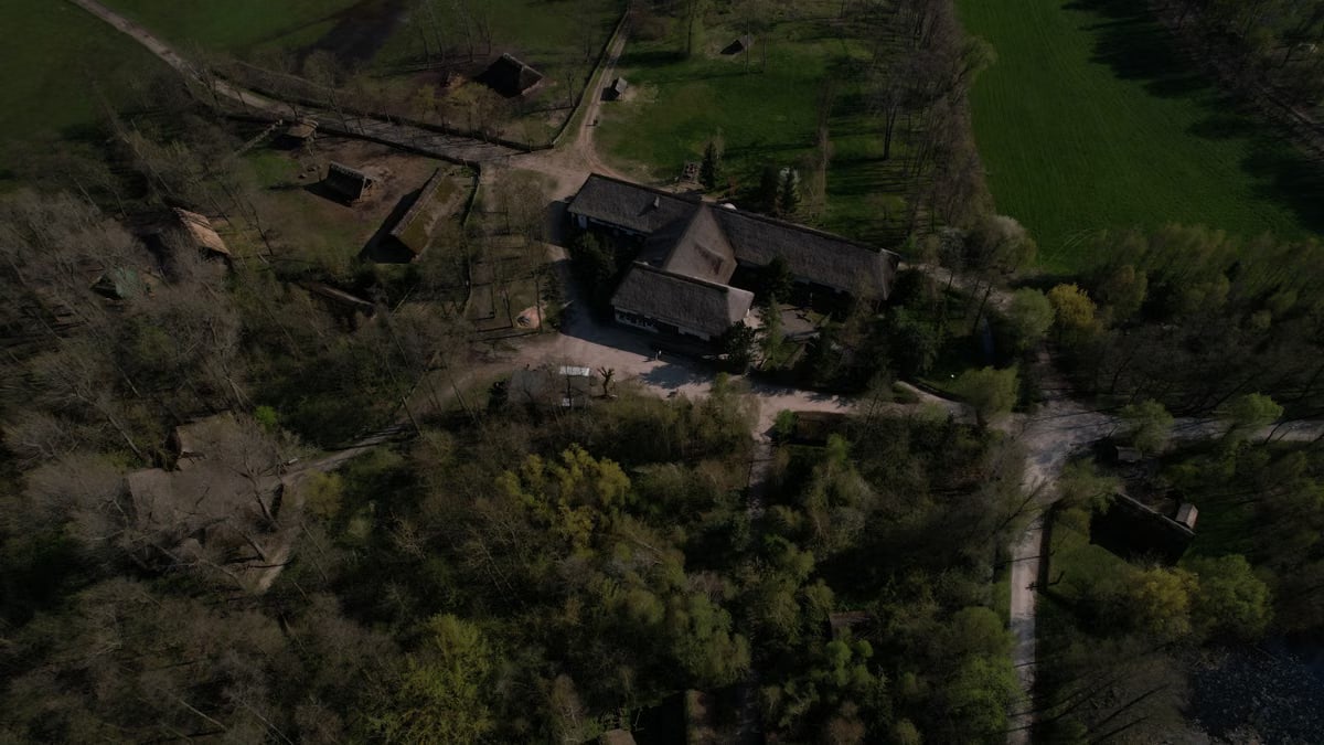 Aerial view of the Biskupin archaeological site in Poland, showcasing ancient village structures.